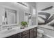 Well-lit bathroom featuring granite vanity, artwork and stylish mirrors at 20340 E Camacho Rd, Queen Creek, AZ 85142