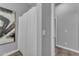 Bright bathroom features shower with curtain, tile flooring and modern art at 20340 E Camacho Rd, Queen Creek, AZ 85142