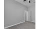 Large bedroom features sleek flooring, base molding, and doorway to hallway at 20340 E Camacho Rd, Queen Creek, AZ 85142