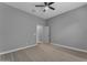 Comfortable bedroom with plush carpet, ceiling fan, and neutral walls ready for personalization at 20340 E Camacho Rd, Queen Creek, AZ 85142