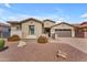 Charming single-story home with desert landscaping, gated entry, and a two-car garage at 20340 E Camacho Rd, Queen Creek, AZ 85142