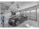 Clean and organized garage with epoxy floors and built-in cabinets, showcasing ample storage space at 20340 E Camacho Rd, Queen Creek, AZ 85142