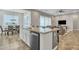 Kitchen island featuring granite countertops and stainless steel appliances overlooks the casual dining area at 20340 E Camacho Rd, Queen Creek, AZ 85142