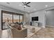 Comfortable living room with a large sliding glass door leading to the backyard pool at 20340 E Camacho Rd, Queen Creek, AZ 85142