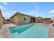 A private pool with a modern design and lush backyard landscaping, perfect for relaxation at 20340 E Camacho Rd, Queen Creek, AZ 85142