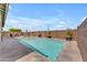 Sparkling pool with Baja step and desert landscaping surrounded by a spacious deck at 20340 E Camacho Rd, Queen Creek, AZ 85142