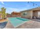Tranquil backyard pool featuring vibrant cacti, and a spacious lounge area at 20340 E Camacho Rd, Queen Creek, AZ 85142