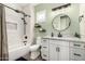 Charming bathroom with stylish vanity, granite countertop, and a shower-tub combo at 21266 S 213Th Pl, Queen Creek, AZ 85142