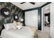 Bedroom view featuring wall decor, a closet, and views of the doorframe at 21266 S 213Th Pl, Queen Creek, AZ 85142