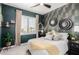 Serene bedroom featuring fern wallpaper, white bedding, and black framed decor at 21266 S 213Th Pl, Queen Creek, AZ 85142