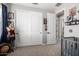 Bedroom featuring decor, sliding closet doors, and view of the en suite bathroom at 21266 S 213Th Pl, Queen Creek, AZ 85142