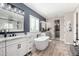 Bright main bathroom with double vanity, freestanding tub, and modern fixtures at 21266 S 213Th Pl, Queen Creek, AZ 85142