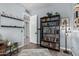 Office or flex room with an open doorway, light-blue walls, and a tall bookshelf at 21266 S 213Th Pl, Queen Creek, AZ 85142