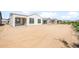 Exterior view of a newly constructed home with desert landscaping and a spacious backyard at 21296 N 270Th Dr, Buckeye, AZ 85396