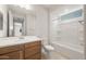 This is a view of the bathroom with a single sink vanity and a shower and bath combination tub at 21296 N 270Th Dr, Buckeye, AZ 85396