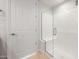 Modern bathroom with glass enclosed shower and white door at 21296 N 270Th Dr, Buckeye, AZ 85396