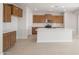 This is a view of the kitchen which boasts stainless steel appliances, granite countertops and lots of natural light at 21296 N 270Th Dr, Buckeye, AZ 85396