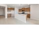 This is a view of the kitchen which includes a kitchen island and stainless steel appliances at 21296 N 270Th Dr, Buckeye, AZ 85396