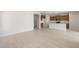 This is a view of the open concept living room which adjoins the kitchen and has tile flooring at 21296 N 270Th Dr, Buckeye, AZ 85396