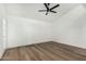Bright bedroom with modern ceiling fan and attractive wood-look flooring at 220 N 22Nd Pl # 2041, Mesa, AZ 85213