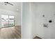 Bright laundry area with large sliding glass doors to a balcony at 220 N 22Nd Pl # 2041, Mesa, AZ 85213