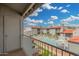 Balcony view of a pristine community pool surrounded by lush greenery and well-maintained condo buildings at 220 N 22Nd Pl # 2041, Mesa, AZ 85213