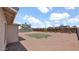 Large gravel backyard featuring a young shade tree and fenced perimeter at 2234 W Mohawk Ln, Phoenix, AZ 85027