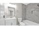Clean and modern bathroom featuring marbled tile, new fixtures, and ample storage at 2234 W Mohawk Ln, Phoenix, AZ 85027