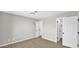 Bedroom with wood-look floors and multiple doors at 2234 W Mohawk Ln, Phoenix, AZ 85027