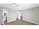 Bedroom with wood-look floors, open closet, and door to bathroom with vanity at 2234 W Mohawk Ln, Phoenix, AZ 85027