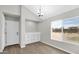 Bright dining room boasts vinyl floors, built-in cabinets, and a large window with backyard view at 2234 W Mohawk Ln, Phoenix, AZ 85027