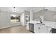 Modern kitchen with stainless steel appliances, white cabinets and bright light at 2234 W Mohawk Ln, Phoenix, AZ 85027