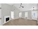 Living room with vaulted ceilings, fireplace, and wood-look flooring at 2234 W Mohawk Ln, Phoenix, AZ 85027