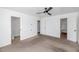 Large bedroom with ceiling fan and access to a toilet and closet at 2262 E Javelina Ave, Mesa, AZ 85204