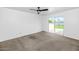 Large bedroom featuring a ceiling fan and sliding glass doors to the backyard at 2262 E Javelina Ave, Mesa, AZ 85204