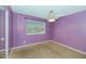 Bedroom with purple walls, mirrored closet doors, ceiling fan, and natural light at 2262 E Javelina Ave, Mesa, AZ 85204