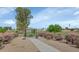 The community park features green space, gravel landscaping, and a covered picnic table at 2262 E Javelina Ave, Mesa, AZ 85204