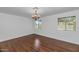 Bright dining room featuring hardwood flooring and a chandelier at 2262 E Javelina Ave, Mesa, AZ 85204