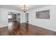 Bright dining room with hardwood floors and a view to the living room and kitchen at 2262 E Javelina Ave, Mesa, AZ 85204