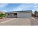 A single story house with a two-car garage and desert landscaping at 2262 E Javelina Ave, Mesa, AZ 85204