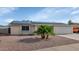 Charming single-story home with desert landscaping, solar panels and a two-car garage at 2262 E Javelina Ave, Mesa, AZ 85204