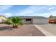 Charming single-story home with desert landscaping and a two-car garage at 2262 E Javelina Ave, Mesa, AZ 85204