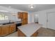 Well-lit kitchen with a center island and wooden cabinets at 2262 E Javelina Ave, Mesa, AZ 85204