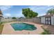 The backyard features a private pool with clear water, next to a storage shed at 2262 E Javelina Ave, Mesa, AZ 85204