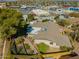 An aerial view shows the home, desert landscaping, and the neighborhood at 2433 E Acoma Dr, Phoenix, AZ 85032