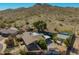 Aerial view of a home with a large lot featuring mature trees, desert landscaping and mountain views at 2433 E Acoma Dr, Phoenix, AZ 85032