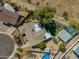 Aerial view of home with pool, landscaped backyard, patio, desert landscaping and mountain views at 2433 E Acoma Dr, Phoenix, AZ 85032