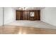 Light-filled living room featuring carpet and a built-in bookshelf at 2433 E Acoma Dr, Phoenix, AZ 85032