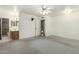 Large main bedroom with carpet, ceiling fan, ensuite bathroom at 2433 E Acoma Dr, Phoenix, AZ 85032