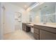 Bright bathroom features double sinks, modern cabinetry, and ample counter space at 25188 N 174Th Ave, Surprise, AZ 85387